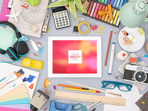 Desk with Tablet and Colorful Art Supplies Mockup