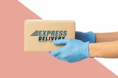 Closeup delivery man holding cardboard box mockup