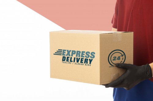 Closeup delivery man holding cardboard box mockup