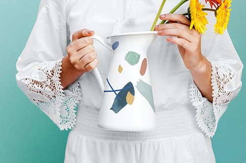 Girl holding a jug mockup with daisies 1210116