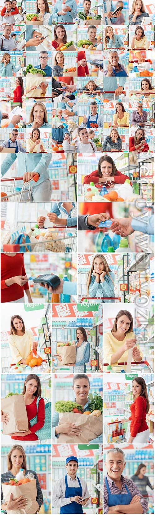 Men and women in super market shopping stock photo