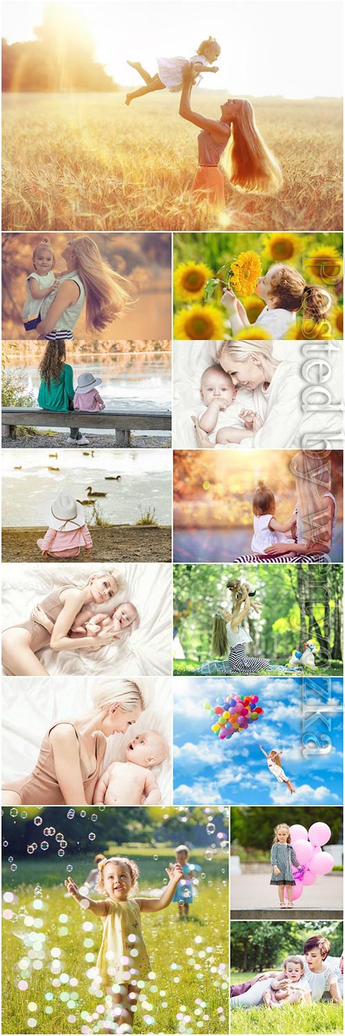 Children with mothers in nature stock photo