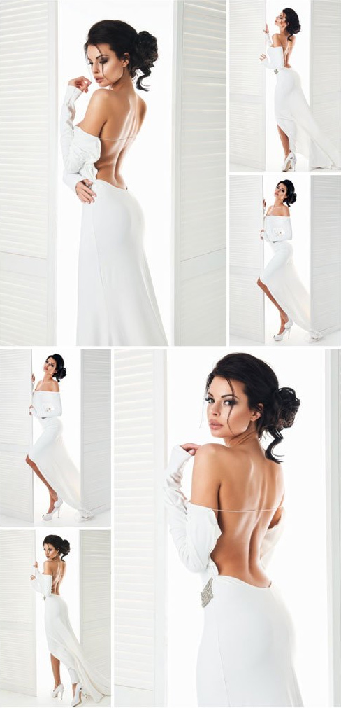 Charming girl in a long white dress - stock photos