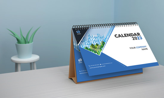 Desk Calendar Mockup with Blue Abstract 527882350