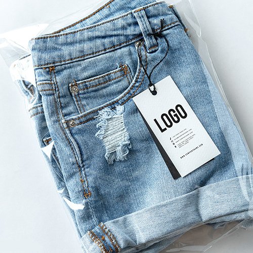 Ripped jean shorts with a tag PSD mockup