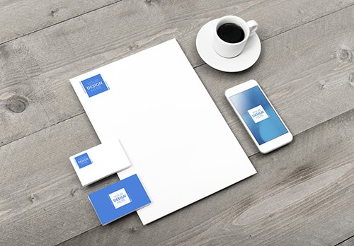 Stationery and Smartphone Mockup with Espresso on Wooden Table