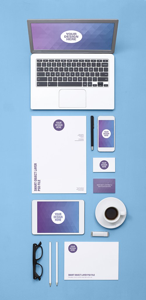 Tablet and Smartphone with Stationery on Blue Surface Mockup